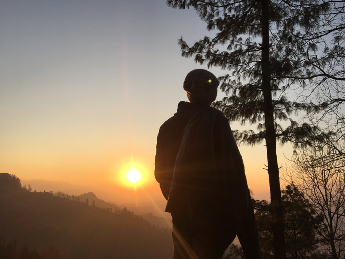 Man watching sunset after recovery from drugs. Soberlife.